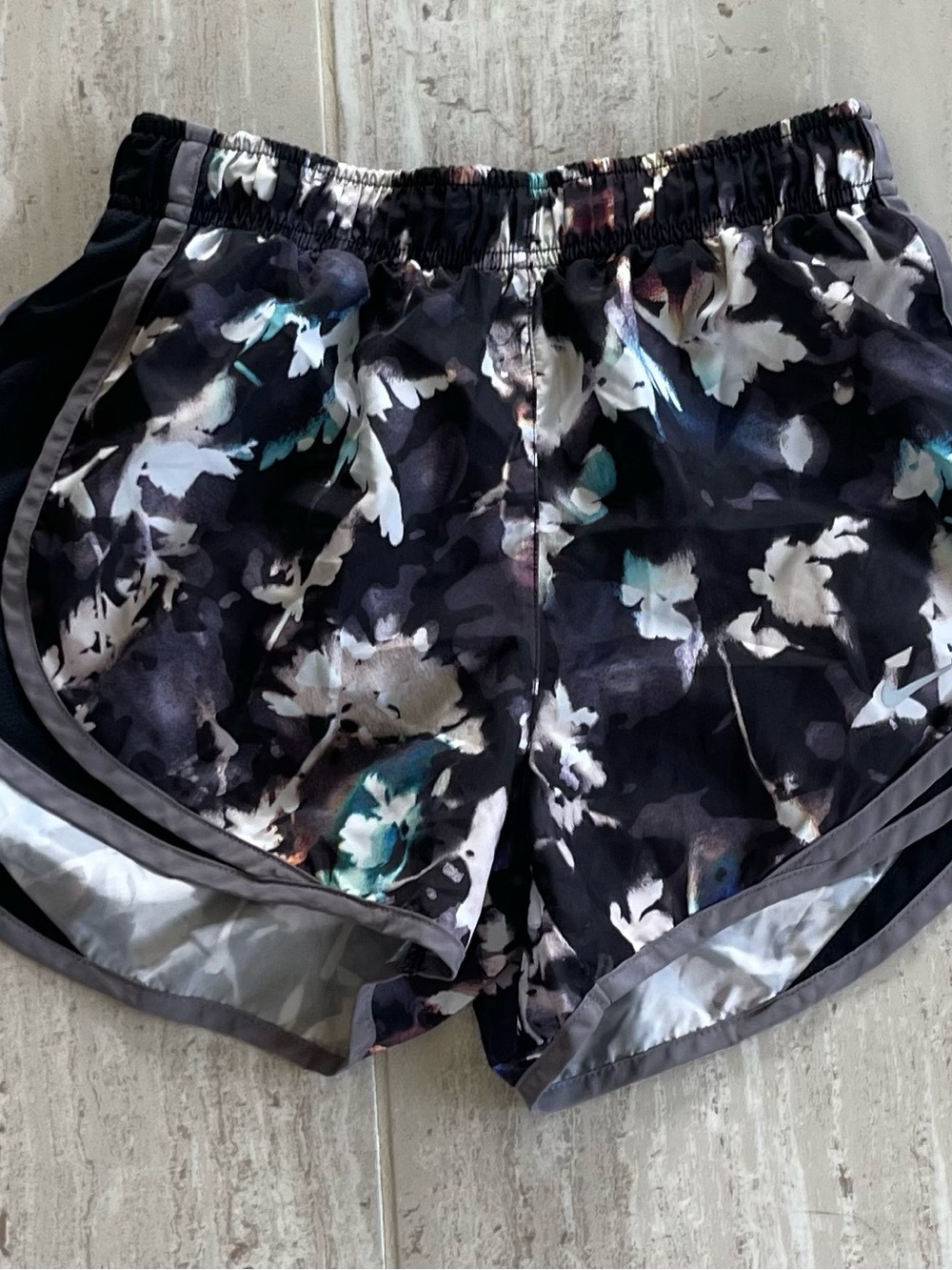 Nike Women’s Black Floral Athletic Shorts with Teal Accents